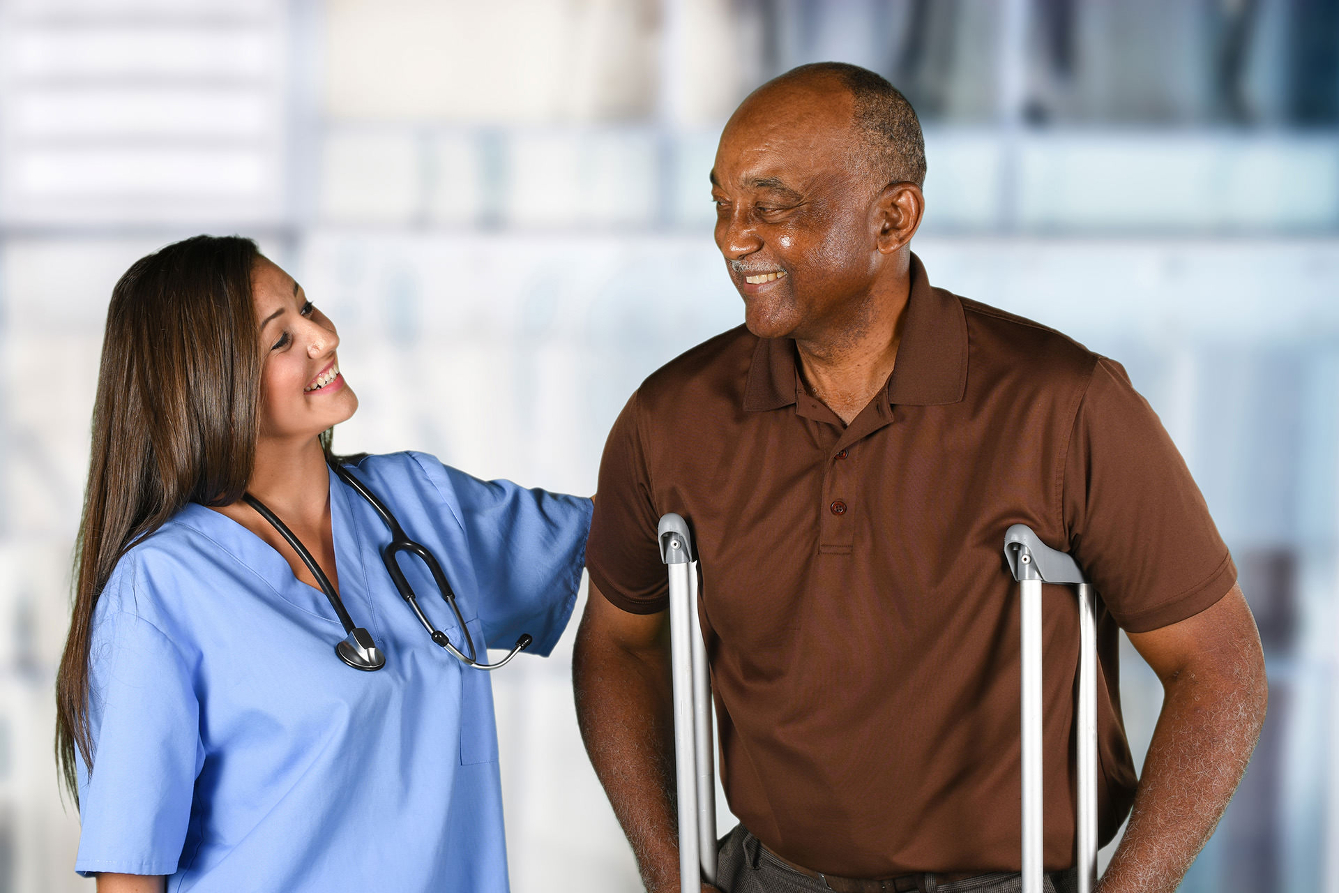 Health care worker helping an elderly patient
